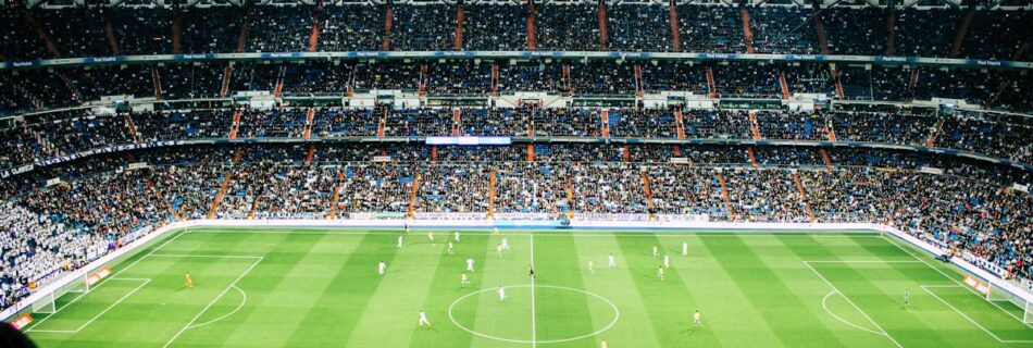 Football match underway in a stadium
